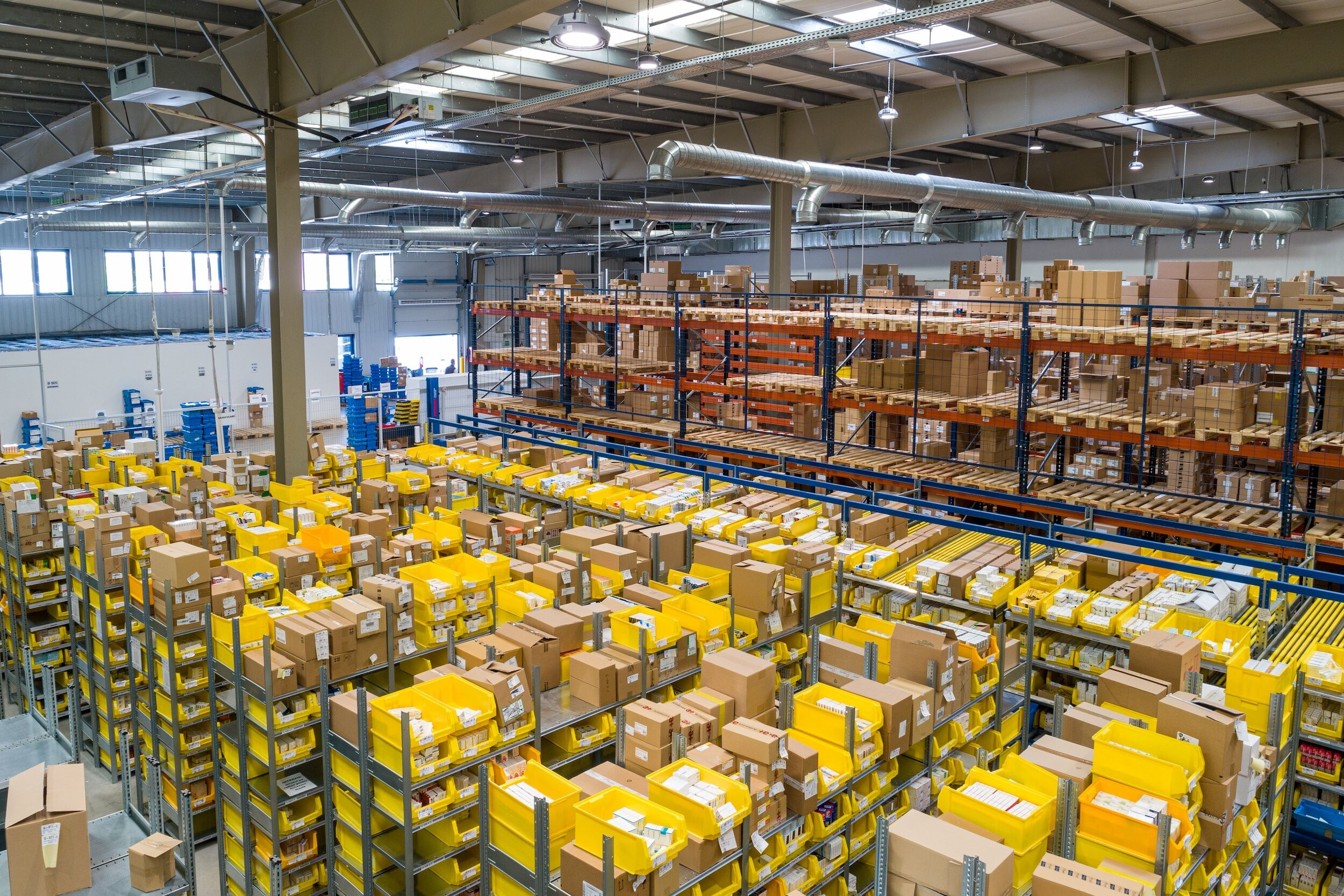 Digital warehouse with network connectivity overlay showing advanced warehouse management technology