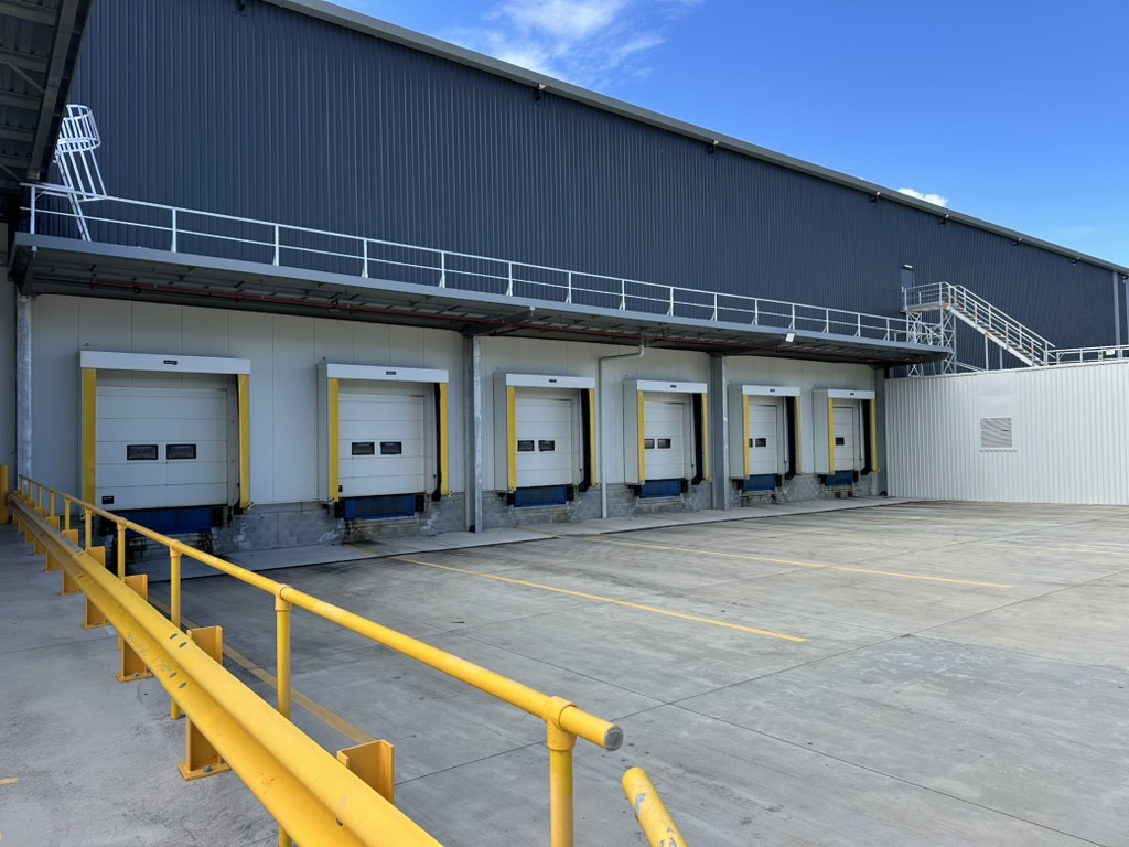 Warehouse loading dock area with multiple bay doors